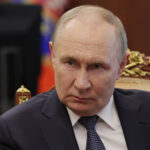 Putin Rejects Western Role in Ukraine, Issues Troop Warning